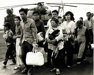 South Vietnamese refugees walk across a U.S. Navy vessel during Operation Frequent Wind. Via Wikimedia Commons