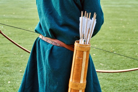 Quiver with arrows on medieval archer's back.